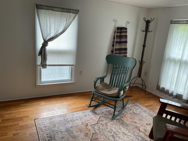 50 N Sprague St, Coldwater, MI 49036 - living area with plenty of natural light and wood finished floors