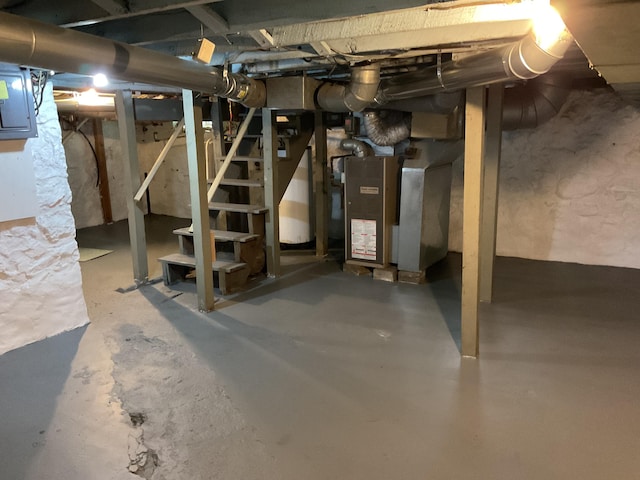 50 N Sprague St, Coldwater, MI 49036 - unfinished basement with stairway, heating unit, and electric panel