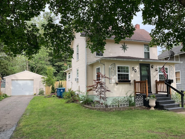 50 N Sprague St, Coldwater, MI 49036 - view of front of home with an outbuilding, a front lawn, driveway, and a detached garage