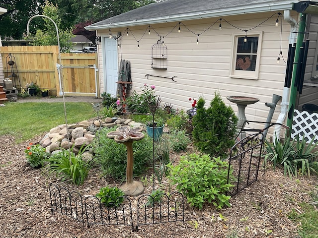 50 N Sprague St, Coldwater, MI 49036 - view of home's exterior with roof with shingles and a gate