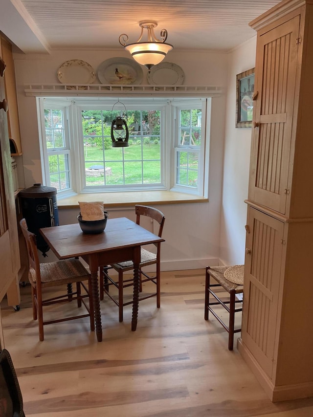50 N Sprague St, Coldwater, MI 49036 - dining area featuring light wood-type flooring, ornamental molding, and baseboards
