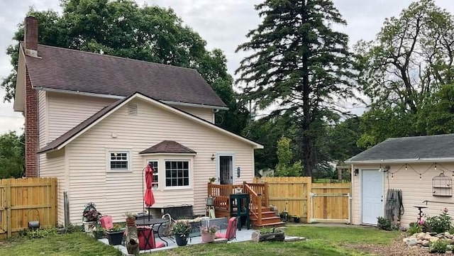 50 N Sprague St, Coldwater, MI 49036 - back of house featuring a gate, a chimney, and a shingled roof