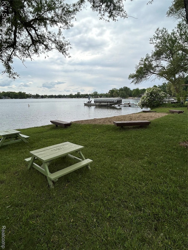 2935 Jackson Blvd, Highland, MI 48356 - view of property's community featuring a water view, a lawn, and a boat dock