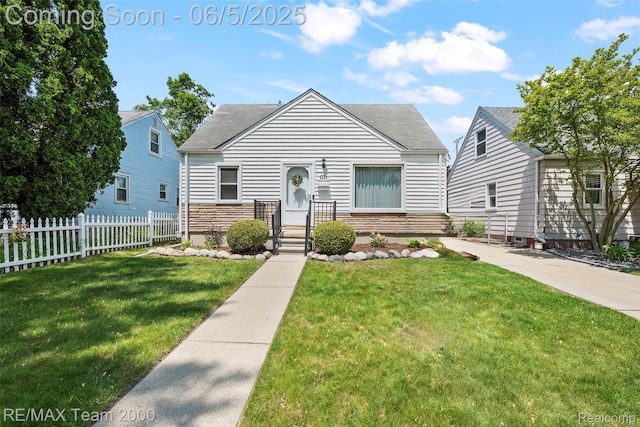 2922 Bailey Ave, Wyandotte, MI 48146 - bungalow-style house with roof with shingles and stone siding