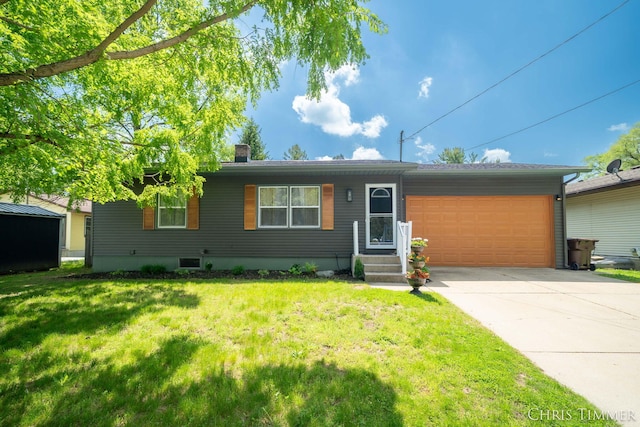 510 W Marshall St, Hastings, MI 49058 - ranch-style house with an attached garage, a chimney, driveway, and a front lawn