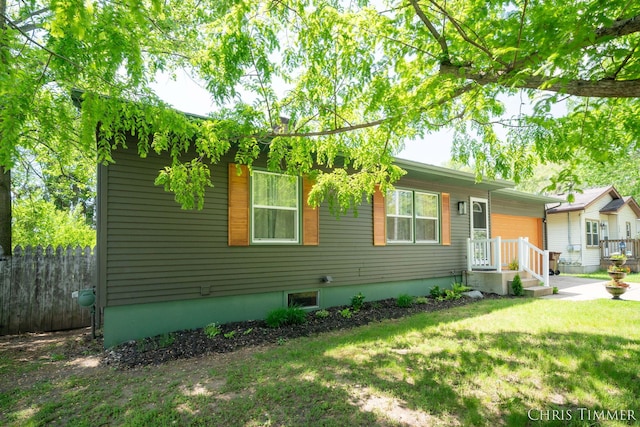 510 W Marshall St, Hastings, MI 49058 - view of front of home featuring an attached garage and a front yard