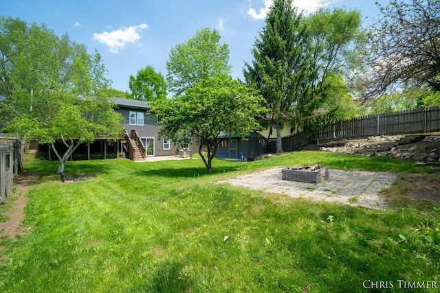 510 W Marshall St, Hastings, MI 49058 - view of yard featuring an outdoor fire pit, stairway, a patio, and a wooden deck