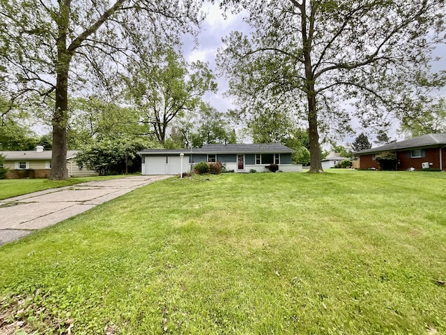 4408 Arbor Dr, Okemos, MI 48864 - ranch-style house with concrete driveway, an attached garage, and a front lawn