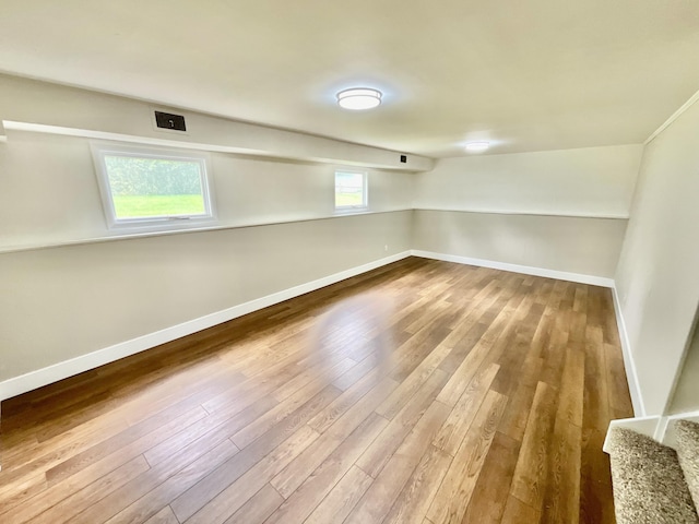 4408 Arbor Dr, Okemos, MI 48864 - below grade area with baseboards and wood finished floors