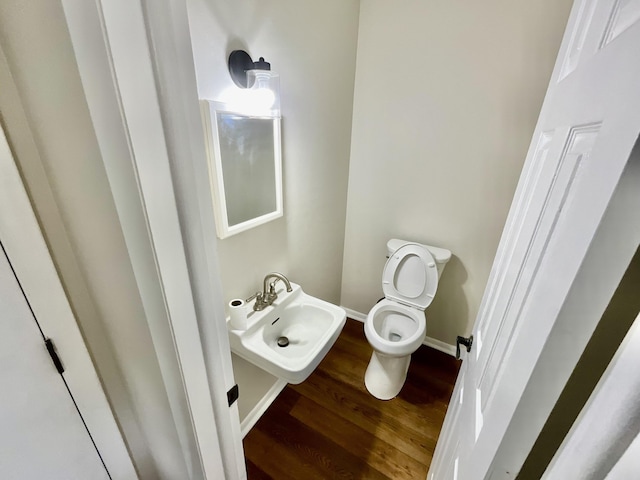 4408 Arbor Dr, Okemos, MI 48864 - bathroom featuring wood finished floors, toilet, and baseboards