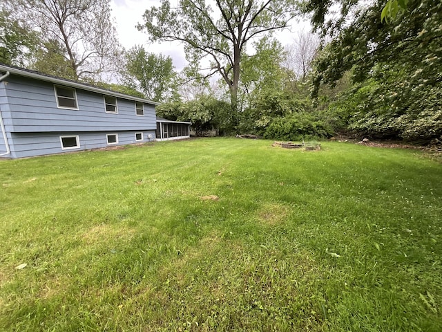 4408 Arbor Dr, Okemos, MI 48864 - view of green lawn with a sunroom