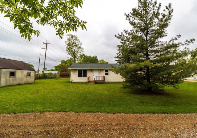 519 S Elm St, Lapeer, MI 48446 - back of house with a lawn
