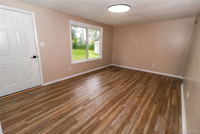 519 S Elm St, Lapeer, MI 48446 - unfurnished room with baseboards and wood finished floors