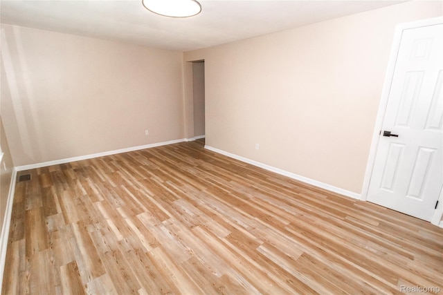 519 S Elm St, Lapeer, MI 48446 - unfurnished room with light wood finished floors and baseboards