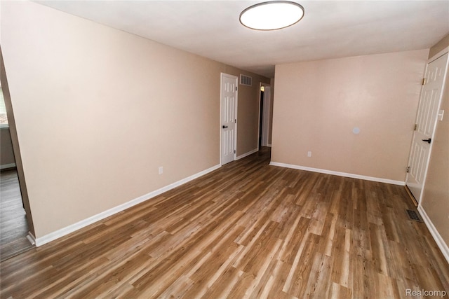 519 S Elm St, Lapeer, MI 48446 - empty room with wood finished floors and baseboards