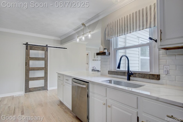 4511 Rosewold Ave, Royal Oak, MI 48073 - kitchen featuring stainless steel dishwasher, a sink, a barn door, white cabinets, and ornamental molding