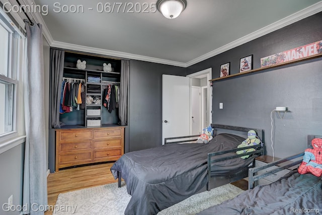 4511 Rosewold Ave, Royal Oak, MI 48073 - bedroom with wood finished floors, a closet, and crown molding