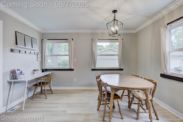 4511 Rosewold Ave, Royal Oak, MI 48073 - dining space with a chandelier, healthy amount of natural light, light wood-style floors, baseboards, and crown molding