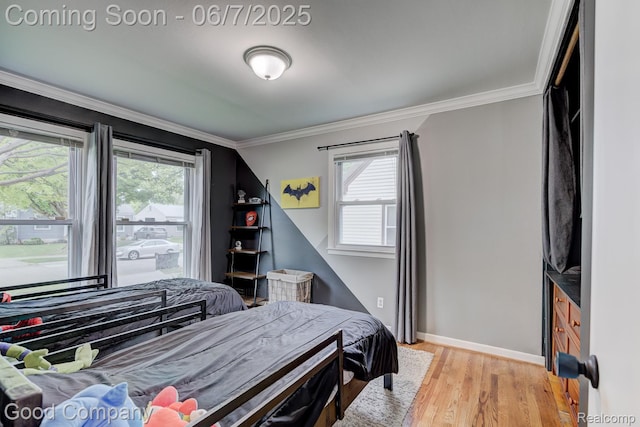 4511 Rosewold Ave, Royal Oak, MI 48073 - bedroom with crown molding, wood finished floors, and baseboards