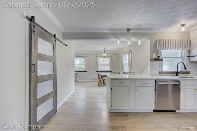 4511 Rosewold Ave, Royal Oak, MI 48073 - kitchen featuring dishwasher, a barn door, a sink, white cabinets, and crown molding