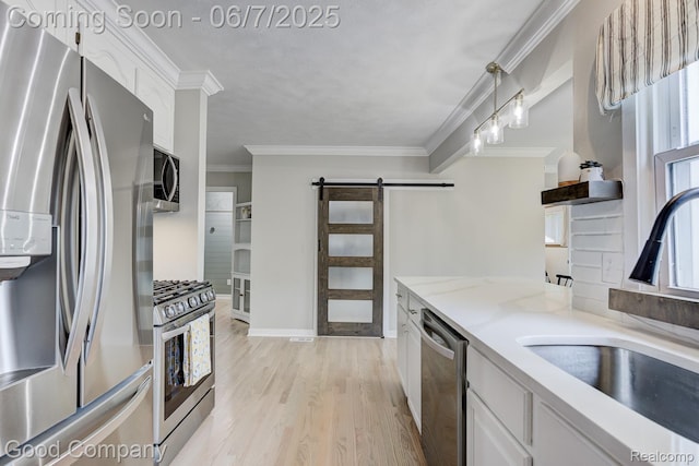 4511 Rosewold Ave, Royal Oak, MI 48073 - kitchen with appliances with stainless steel finishes, a barn door, a sink, ornamental molding, and white cabinetry