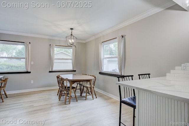 4511 Rosewold Ave, Royal Oak, MI 48073 - dining space with light wood-type flooring, a chandelier, ornamental molding, and baseboards