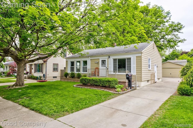 4511 Rosewold Ave, Royal Oak, MI 48073 - view of front of home featuring an outbuilding, a front yard, roof with shingles, and a garage