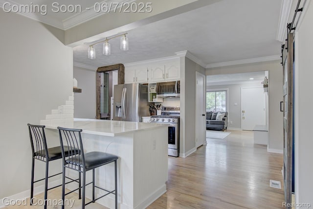 4511 Rosewold Ave, Royal Oak, MI 48073 - kitchen featuring stainless steel appliances, a breakfast bar area, white cabinets, a peninsula, and crown molding