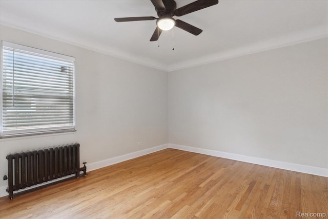 5784 Whittier St, Detroit, MI 48224 - empty room featuring radiator heating unit, baseboards, light wood finished floors, and a ceiling fan