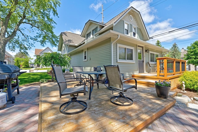 350 N Broadway St, Lake Orion, MI 48362 - wooden deck featuring outdoor dining space and area for grilling