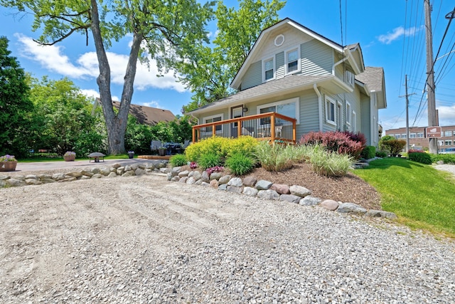 350 N Broadway St, Lake Orion, MI 48362 - view of front of property featuring a deck and a shingled roof