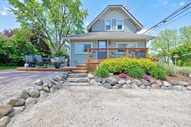 350 N Broadway St, Lake Orion, MI 48362 - view of front of house featuring a deck and a shingled roof