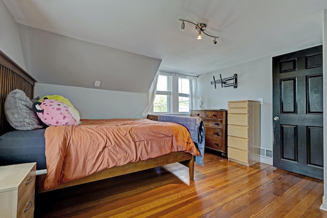 350 N Broadway St, Lake Orion, MI 48362 - bedroom featuring wood finished floors and vaulted ceiling