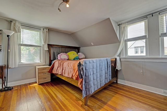 350 N Broadway St, Lake Orion, MI 48362 - bedroom featuring hardwood / wood-style flooring, baseboards, and lofted ceiling