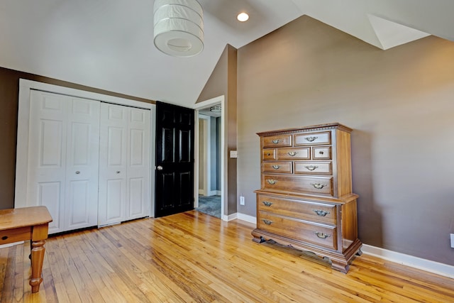 350 N Broadway St, Lake Orion, MI 48362 - bedroom with vaulted ceiling, light wood-style flooring, baseboards, and a closet