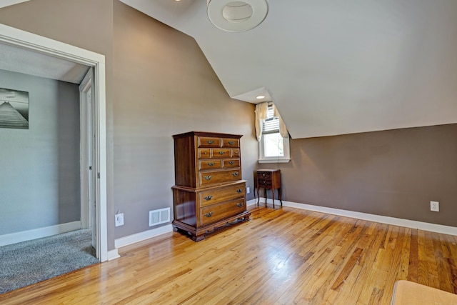 350 N Broadway St, Lake Orion, MI 48362 - additional living space featuring wood finished floors, baseboards, and lofted ceiling