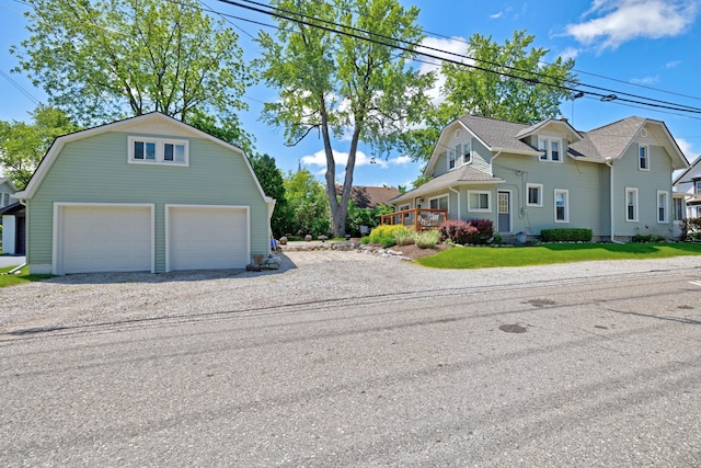 350 N Broadway St, Lake Orion, MI 48362 - view of home's exterior with an outdoor structure, a garage, and a gambrel roof