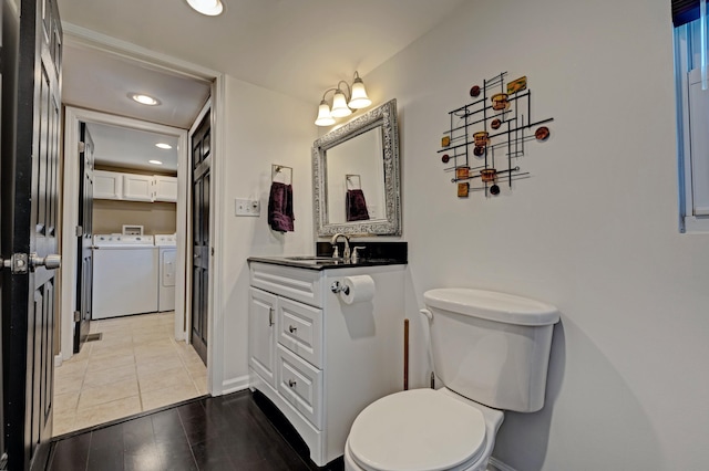 350 N Broadway St, Lake Orion, MI 48362 - bathroom featuring washing machine and dryer, recessed lighting, vanity, toilet, and baseboards
