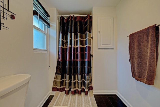 350 N Broadway St, Lake Orion, MI 48362 - full bath with toilet, baseboards, a shower with shower curtain, and wood finished floors