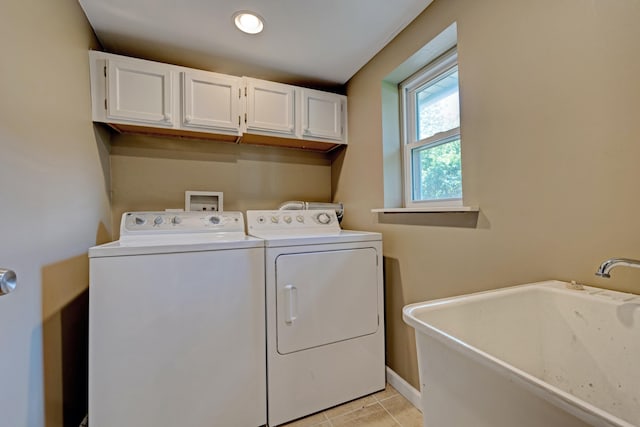 350 N Broadway St, Lake Orion, MI 48362 - laundry area with washing machine and dryer, cabinet space, light tile patterned floors, and baseboards