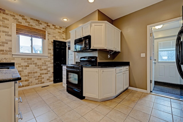 350 N Broadway St, Lake Orion, MI 48362 - kitchen with black appliances, baseboards, white cabinets, dark countertops, and light tile patterned floors
