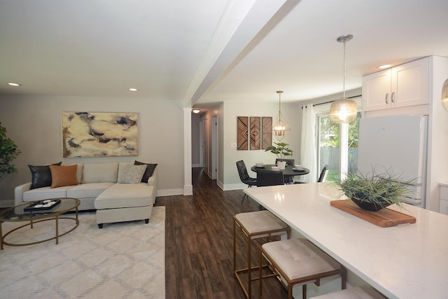 222 S Park St, Zeeland, MI 49464 - living room featuring wood finished floors, baseboards, and recessed lighting