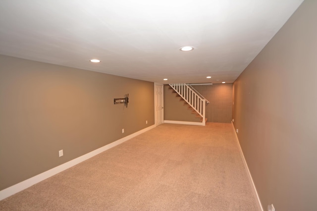 222 S Park St, Zeeland, MI 49464 - finished below grade area featuring recessed lighting, light colored carpet, baseboards, and stairway