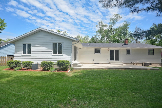 222 S Park St, Zeeland, MI 49464 - back of house with a patio area, cooling unit, and a chimney