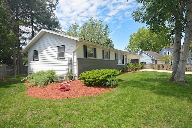 222 S Park St, Zeeland, MI 49464 - view of side of home with a garage and brick siding