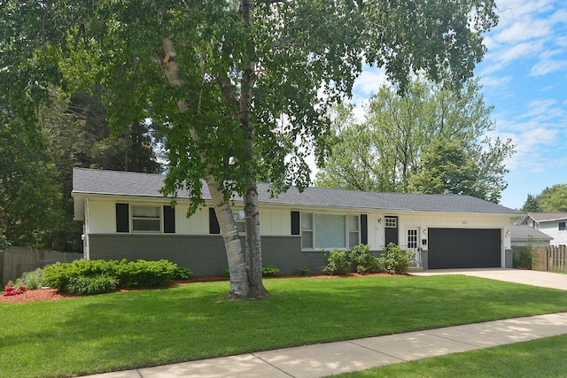 222 S Park St, Zeeland, MI 49464 - ranch-style house featuring a garage, brick siding, and driveway
