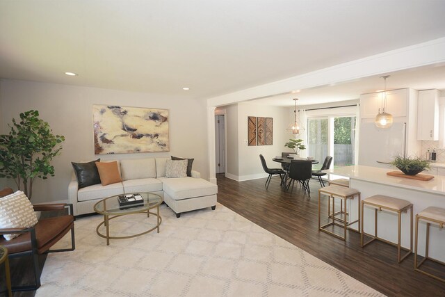222 S Park St, Zeeland, MI 49464 - living room with wood finished floors, baseboards, and recessed lighting