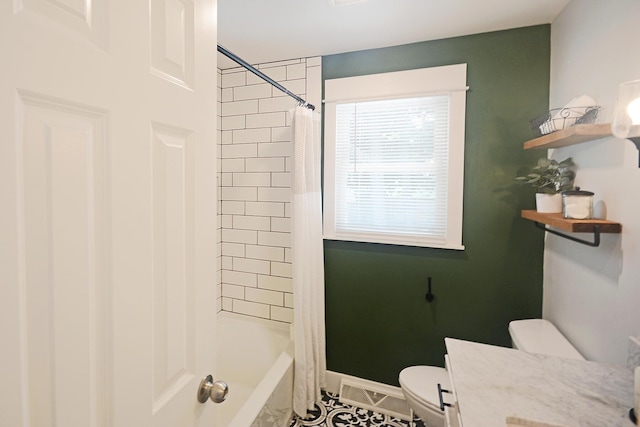 222 S Park St, Zeeland, MI 49464 - bathroom featuring toilet, shower / tub combo with curtain, tile patterned flooring, and vanity