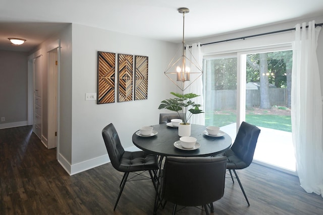 222 S Park St, Zeeland, MI 49464 - dining room featuring a chandelier, baseboards, and dark wood-style floors
