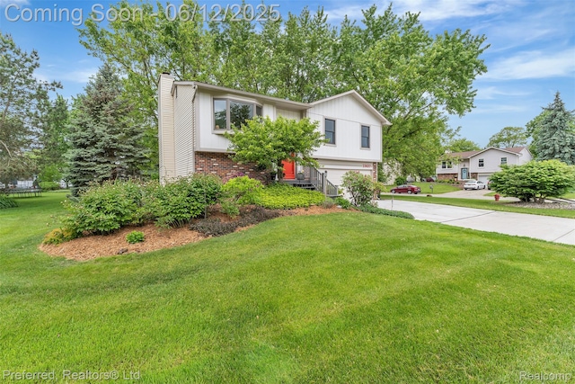 23637 Cranbrooke Dr, Novi, MI 48375 - view of front of property featuring a chimney, driveway, brick siding, a garage, and a front lawn